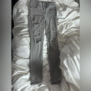 Gray ripped skinny AE jeans